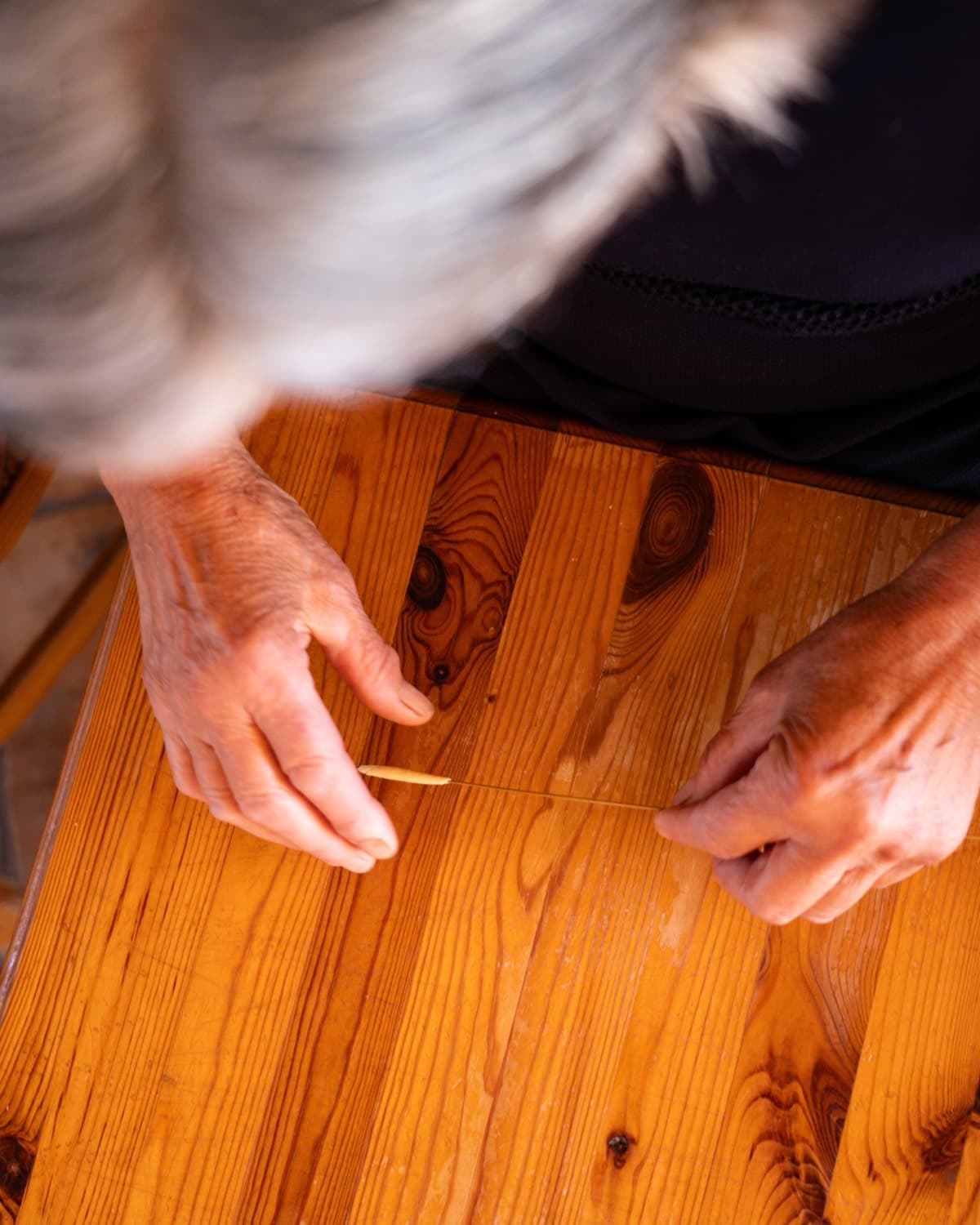 Hands making traditional pasta